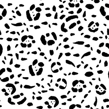 Seamless animal print, black spots on a white background. Stock vector illustration.