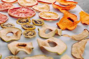 Dried fruits and vegetables slices on white background