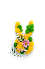 Easter bunny made from flowers on white background