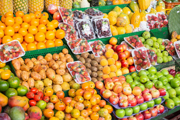 pile of fruits on the shelf of a Colombian market