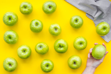 summer fruit pattern with apples on yellow background top view