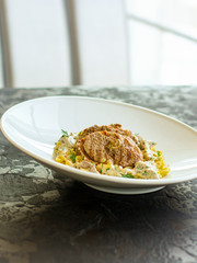 roast meat, pasta Annellini and creamy sauce (main dish). food background. top view