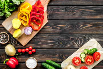 cooking with raw vegetables on dark wooden background top view mockup