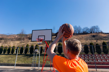 Rear view of basketball player shooting on hoop © Novak