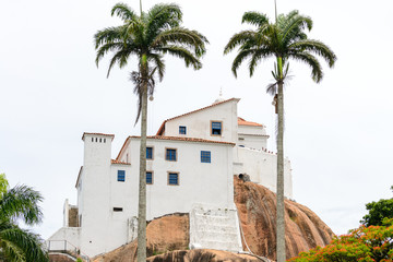 Fototapeta na wymiar Detail of the beautiful Convento Da Penha on top of a hill and surrounded by nature in Vitòria, Espirito Santo, Brazil