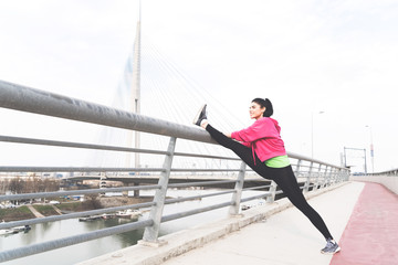 Sporty girl stretching