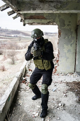 Special forces police soldier training airsoft SWAT terrorist guard watch holding weapon aiming