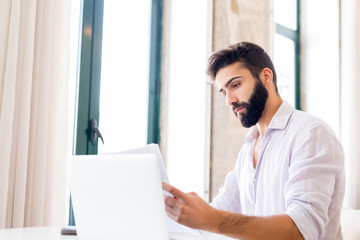 Man working on laptop from home