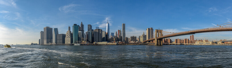 Manhattan skyline on a sunny day with Brooklyn Bridge in view