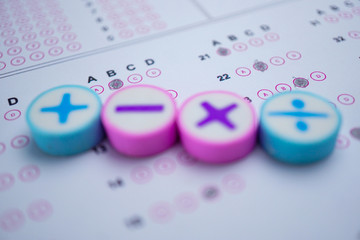 Blur Math symbol and pencil on Answer sheet background : Education study mathematics learning teach...