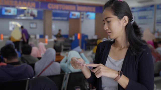 portrait a woman waits long for a turn when queuing in public services