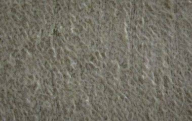 rough fleecy fabric with fiber and wool, close-up.