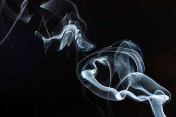 Smoke swirls on black background