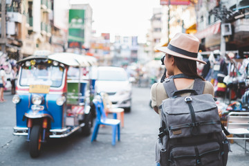 Asian traveler/tourist walking and travelling in Khao San rd. walk street, Bangkok, Thailand - obrazy, fototapety, plakaty