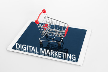 Digital Marketing. Shopping cart on digital tablet, on white background