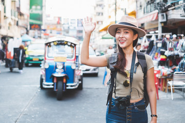 Asian traveler/tourist walking and travelling in Khao San rd. walk street, Bangkok, Thailand