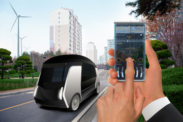 Control of autonomous bus by futuristic smartphone with mobile app . Concept.