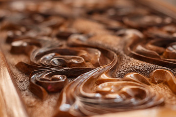delicate wood carving in shades of brown. blur