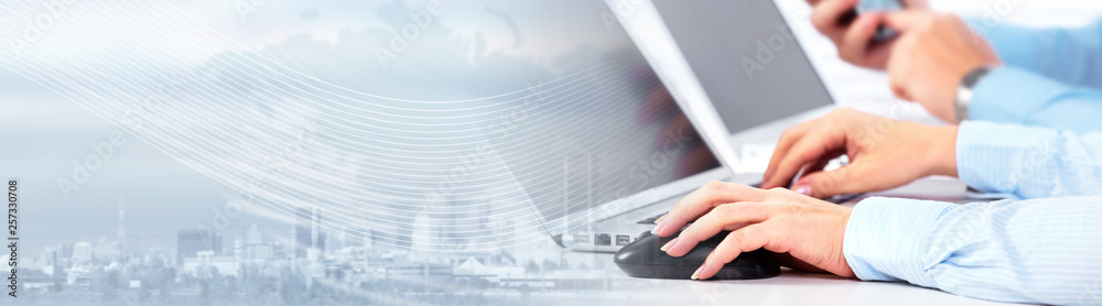 Poster Hands typing on computer laptop.