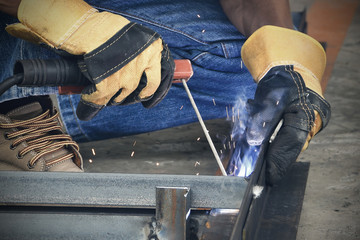 people welding metal