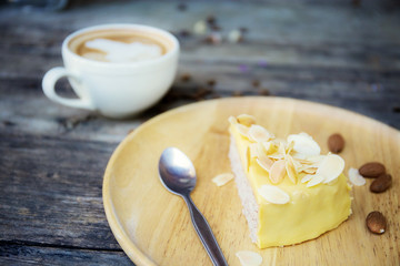 Cake and coffee cup on wooden.