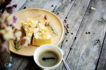 Coffee cup and cake on plate.