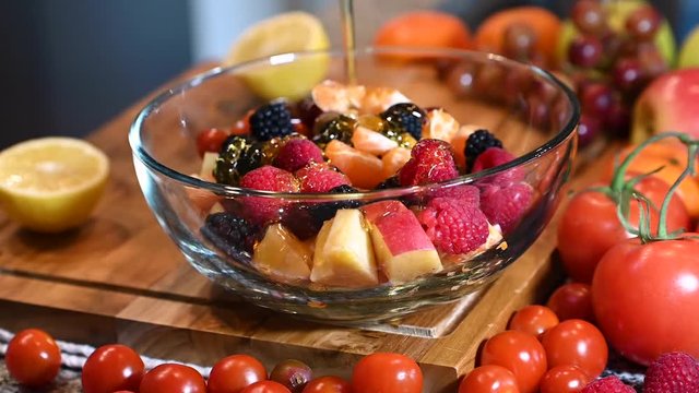 Delicious healthy Fruit Salad by put the honey on top