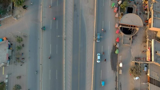 Aerial Drone Footage Of Traffic And City On The Outskirts Of Lahore Pakistan