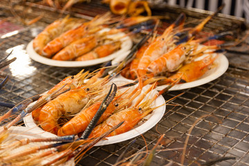 Grilled shrimps seafood on the table in market of Bangkok Thailand 