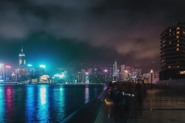 Fototapeta na wymiar Hong Kong cityscape at night. Victoria Harbor of Hong Kong city at night