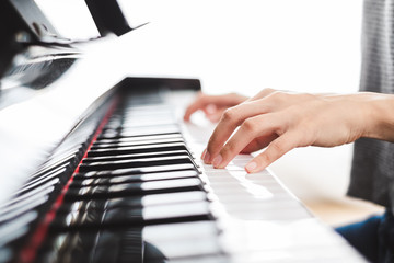 Fototapeta na wymiar Classic piano key with musician hands playing
