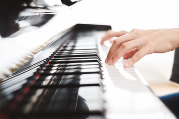 Classic piano key with musician hands playing