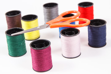 Spools of thread and scissors. Accessories for needlework
