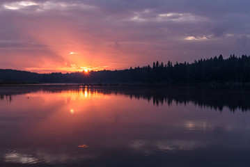 Fototapeta na wymiar lake sunrise sky sun reflection