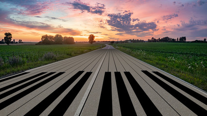 piano keyboard painted on an asphalt road