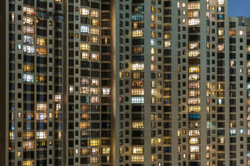 Fototapeta na wymiar modern high rise residential building in Hong Kong city at night