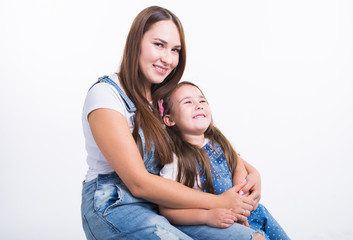 Parenting, family and children concept - Portrait of a mother and her baby girl have fun and smiling over white background