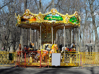 children's carousel yellowish green with small animals