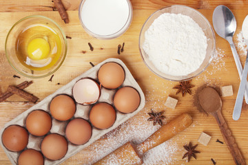 Food ingredients for baking: flour, eggs, milk, sugar	