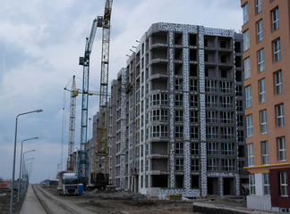 construction of a multi-storey building next to a built house