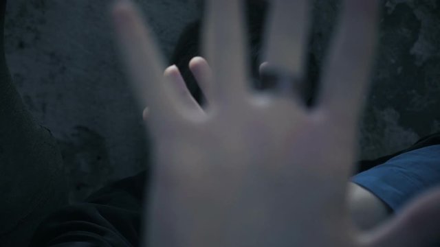 violence against women. Young terrified woman screamig in the dark
