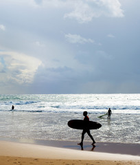 Fototapeta na wymiar Surfer silhouette surfboard beach Portugal