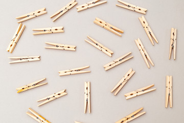 Wooden clothespins on gray background. Flat lay