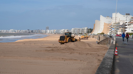 Machines prepare the beach for tourists