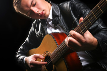 Young men playing the guitar