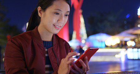 Woman check on smart phone at outdoor