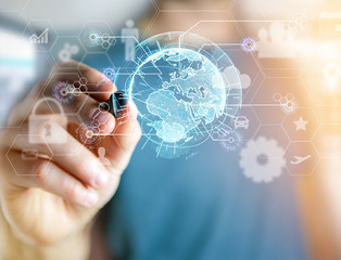 International business network connection displayed on a futuristic interface with technology icon and sphere globe - Worldwide business concept