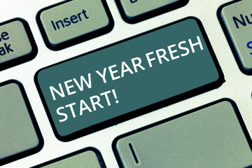 Conceptual hand writing showing New Year Fresh Start. Concept meaning Time to follow resolutions reach out dream job Keyboard key Intention to create computer message idea