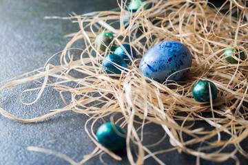 Easter background with painted Easter eggs in vintage style over dark background