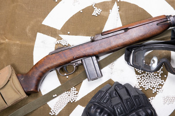 airsoft gun with protective glasses and lot of bullets